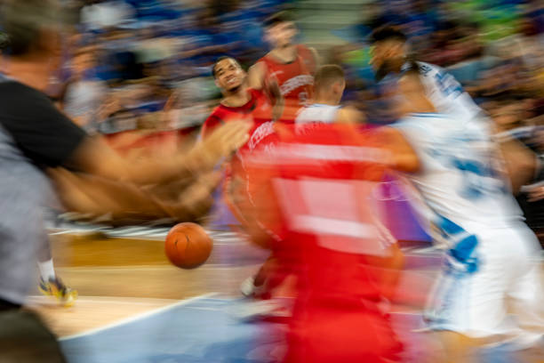 A basketball referee makes call during a game.