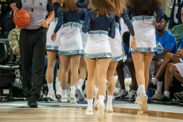 istock Cheerleaders and referee on basketball court 1253705055