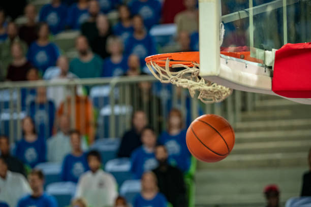 istock Basketball in hoop 1253705707