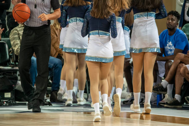 istock Cheerleaders and referee on basketball court 1253705755
