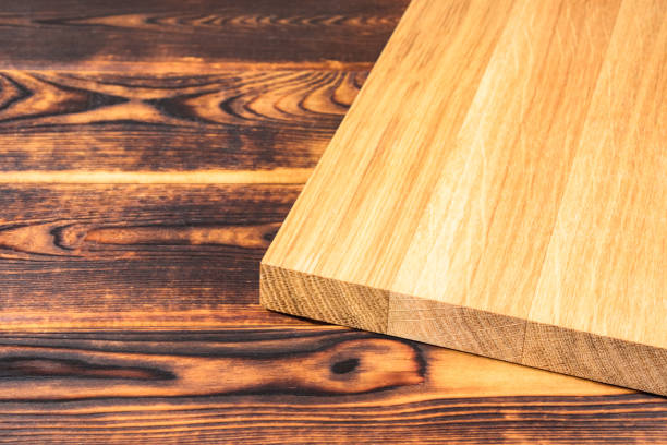 istock cutting Board on a wooden background top view 1253706389