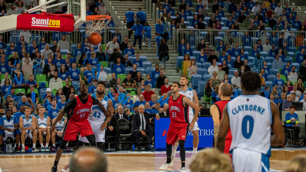 istock Basketball player throwing ball 1253707860