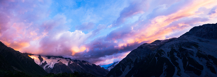 Panoramic shot of the beautiful landscape of Mount Cook at sunrise in the Southern Alps mountains in Mount Cook National Park, New Zealand. Multiple files stitched.