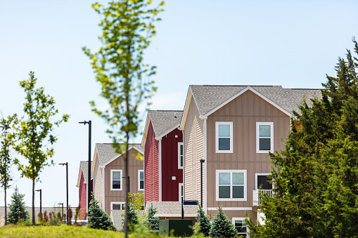 In Northwestern Kansas Row of Bright Multi-Colored Homes on a Sunny Summer Day (Shot with Canon 5DS 50.6mp photos professionally retouched - Lightroom / Photoshop - original size 5792 x 8688 downsampled as needed for clarity and select focus used for dramatic effect)