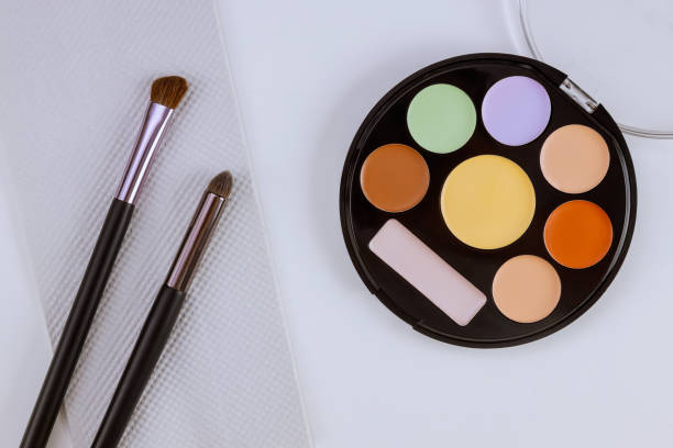 istock Professional pallet of eyeshadow multicolor bright make up on isolated white background 1253712674