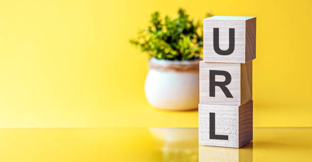 istock Word URL - Uniform Resource Locator - on yellow background 1253712981