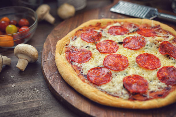 istock Freshly Baked Homemade Pepperoni Pizza 1253716094