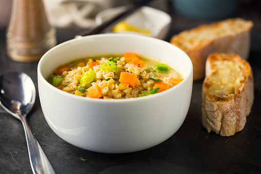 Home made freshness vegan scotch broth service with home baked ciabatta bread with vegan butter