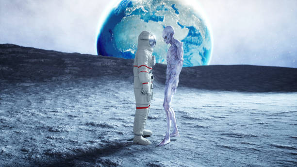 istock Astronaut on the moon with alien. 3d rendering. 1253716304