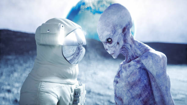 istock Astronaut on the moon with alien. 3d rendering. 1253716316