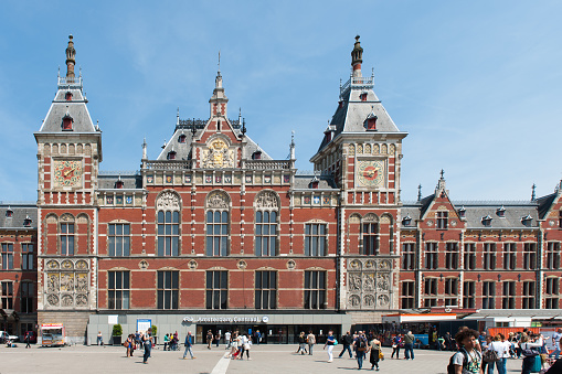 The Amsterdam Central Station and square. The building was designed by the architects P.J.H. Cuypers, A.L. van Gendt and L.J. Eijmer and realised between 1881 and 1889.