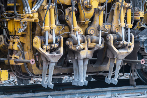 With the tamping picks of a tamping machine the ballast is pushed under the sleepers and compacted
