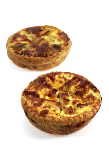 istock Lorraine Quiche and Leek Quiche against White Background 1253720408