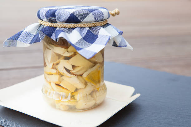 Wild forest mushrooms preserved in a jar.