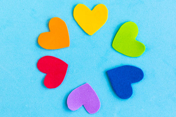 istock Hearts in lgbtq colors on blue background, top view 1253722728