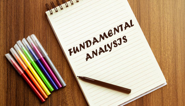 istock FUNDAMENTAL ANALYSIS. your future target searching, a marker, pen, three colored pencils and a notebook for writing 1253723025