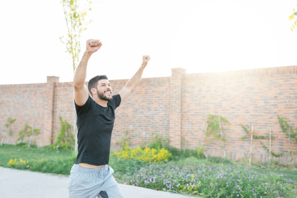 istock Happy Sporty Man Running In Park 1253724239