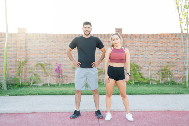 istock Confident Sporty Couple In Park 1253724274