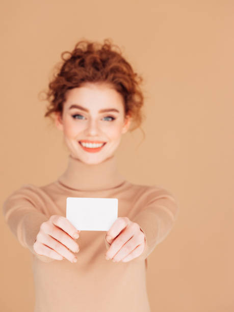 istock Beautiful woman holds placard 1253725545