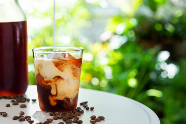 istock glass of cold brew coffee with milk 1253726438