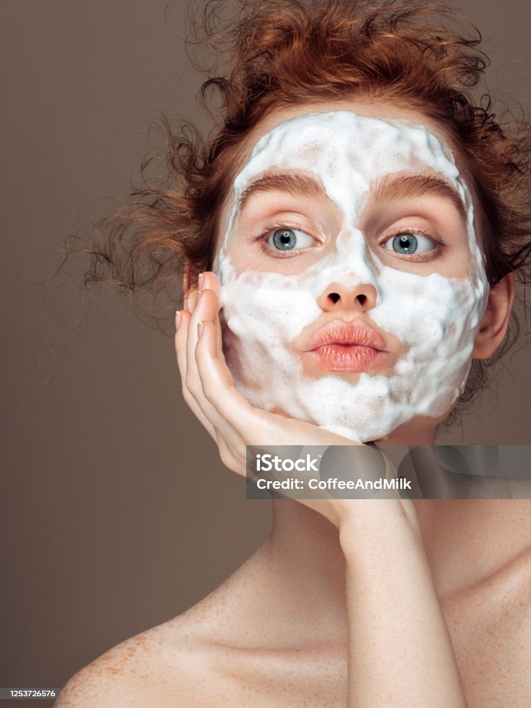 Young woman applies beauty mask Beauty Stock Photo
