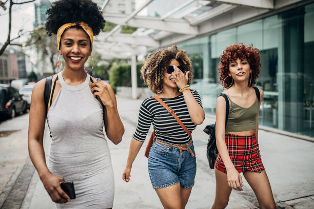 istock Three modern ladies in city 1253726852