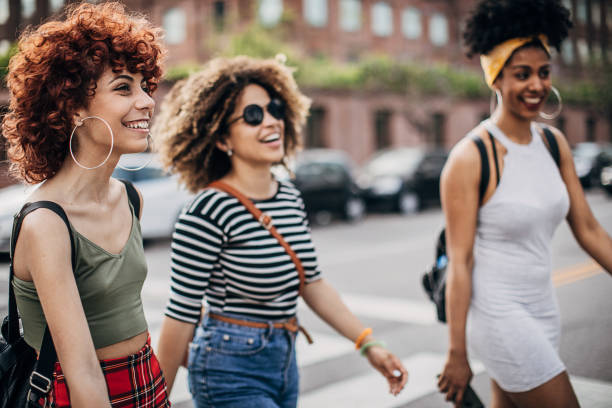 istock Three modern ladies downtown in city 1253727597
