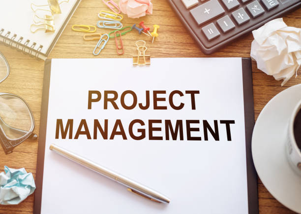 istock Project Management text written on office paper on office table. Business concept 1253728688