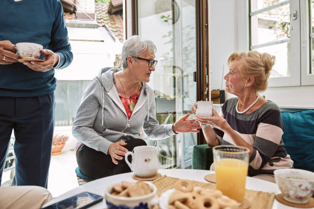 istock Senior women talking over some tea at home 1253729563