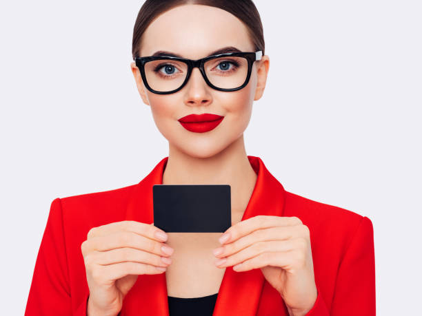 woman holds business card - glasses holding business card imagens e fotografias de stock