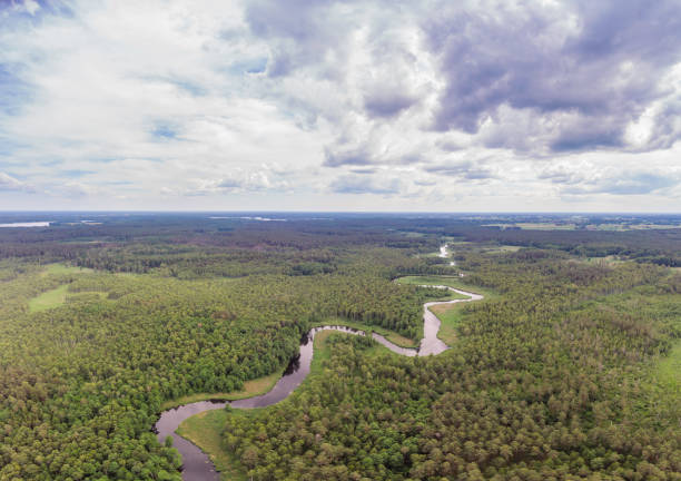 istock rural landscape with a small meandering river (aerial view) 1253729975