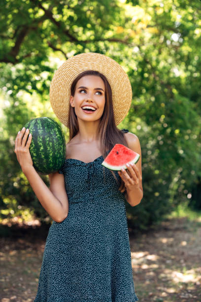 istock Enjoying sunny day wile eating watermelon 1253730655