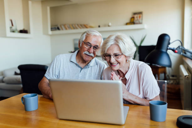 istock Happy elderly couple having fun at home 1253730694