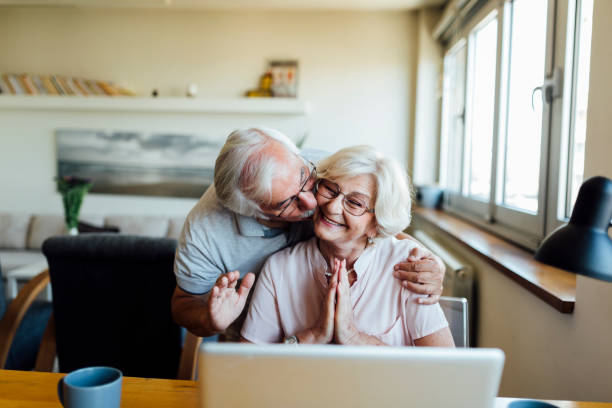 istock Happy elderly couple having fun at home 1253730704