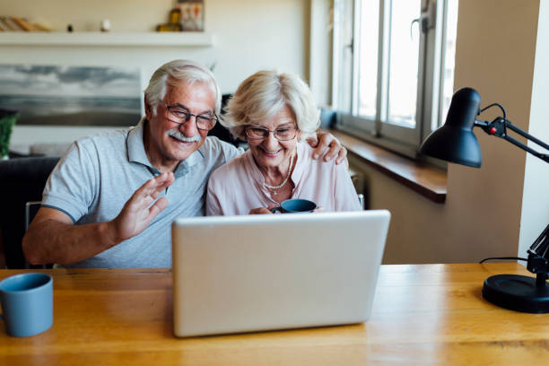 istock Happy elderly couple having fun at home 1253730725