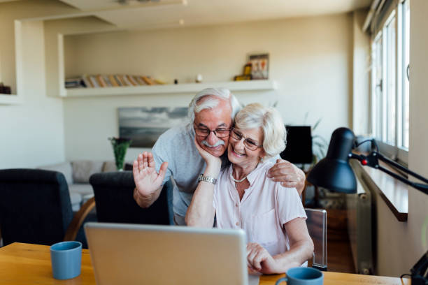 istock Happy elderly couple having fun at home 1253730730