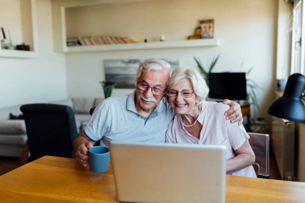 istock Happy elderly couple having fun at home 1253730731