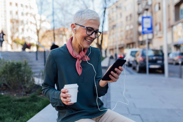 istock Happy senior woman using a smart phone 1253736447