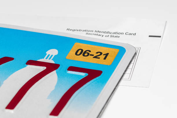 vehicle license plate, renewal sticker and registration card. concept of state government automobile fees, transportation taxes and funding. - secretary of state imagens e fotografias de stock