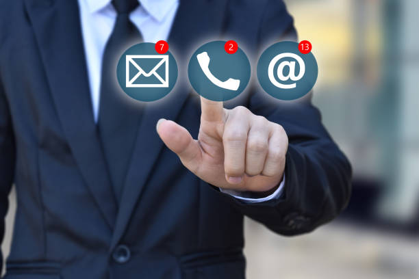 istock Businessman choosing virtual contact icon. 1253752641