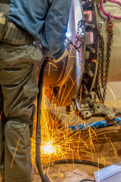 istock A welder grinding and welding 1253752786
