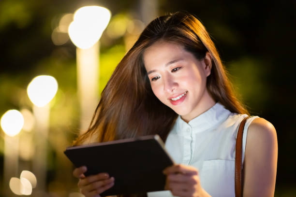 istock woman use digital tablet outdoor 1253762711