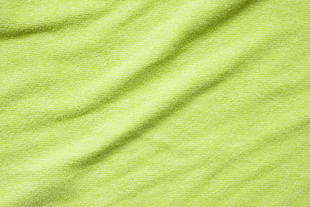 istock Green towel fabric texture surface close up background 1253762825