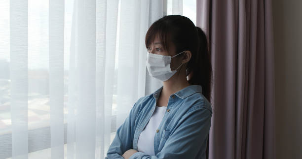 istock woman wear face mask on 1253762863