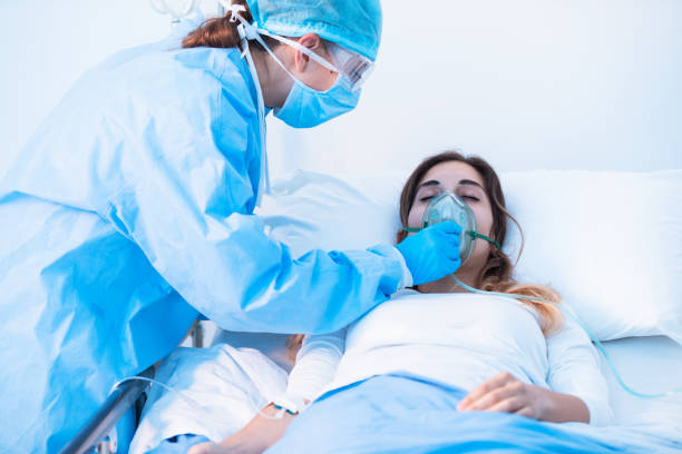 istock Nurse adjusting a positive pressure oxygen mask 1253762924