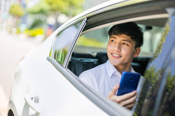 istock businessman commute by taxi 1253777052
