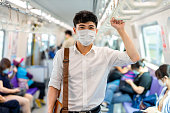 istock man with mask in metro 1253777085