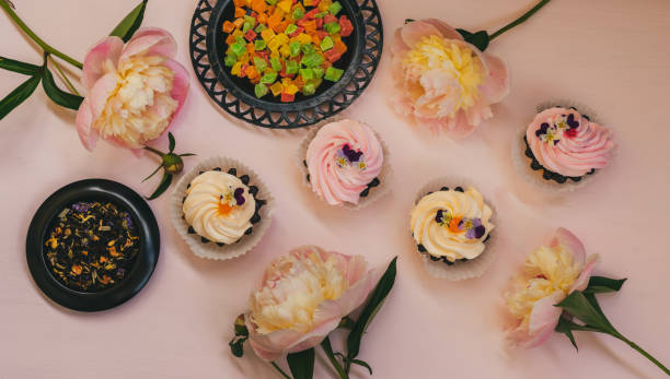 istock Pink peonies, cream cakes and flower tea 1253777961