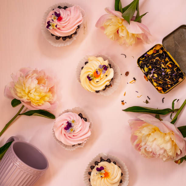 istock Pink peonies, cream cakes and flower tea 1253777964