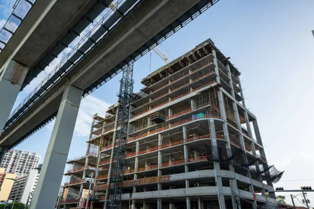 Highrise construction site at Brickell Miami near elevated Metrorail tram tracks